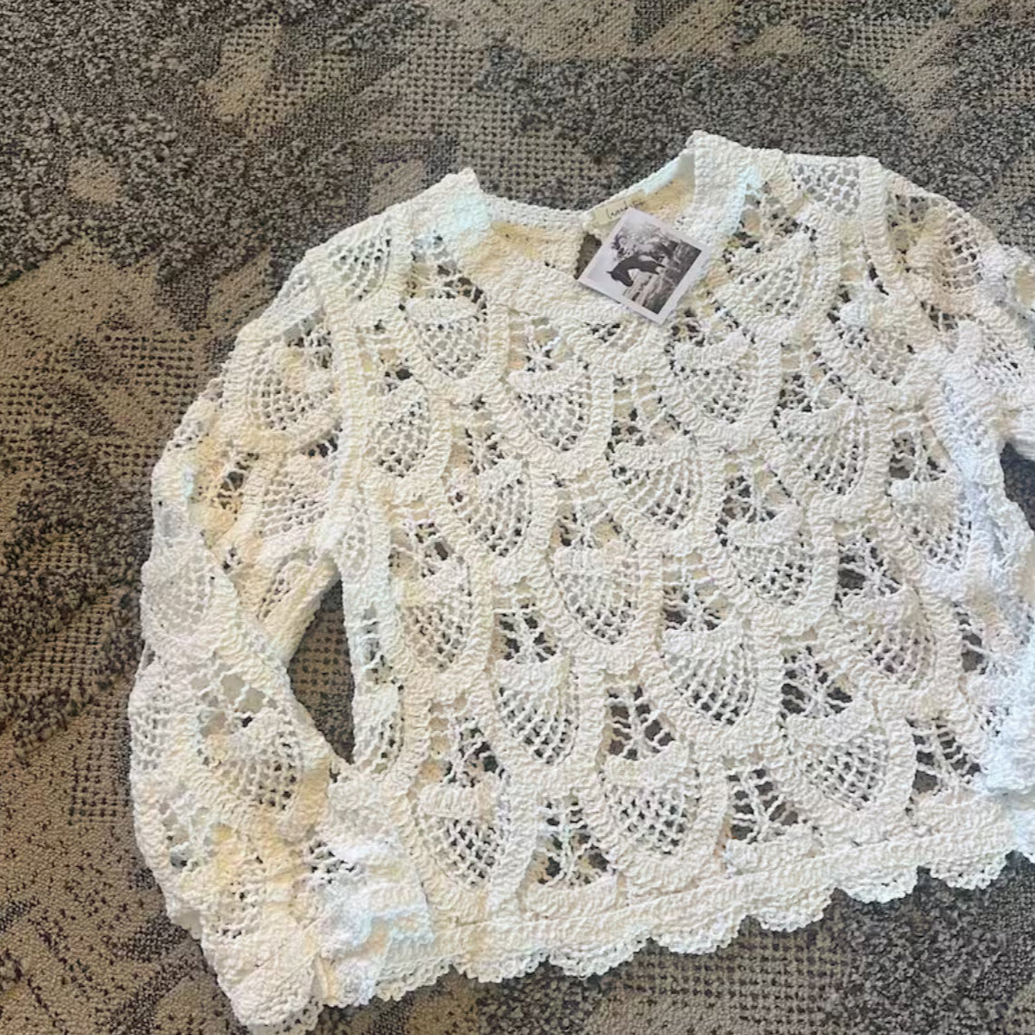 White lace garment on a textured brown background