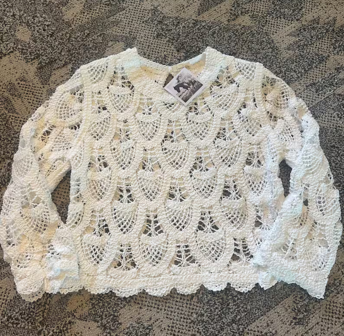 White lace top on a textured surface