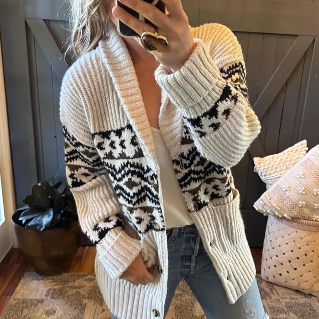 Person wearing a patterned cardigan in a home setting