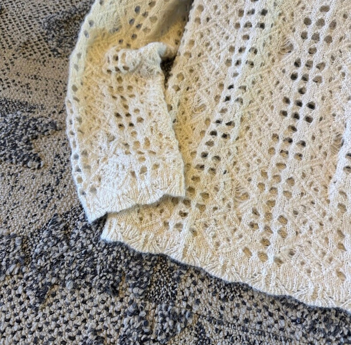 Close-up of a textured fabric with a lace-like pattern