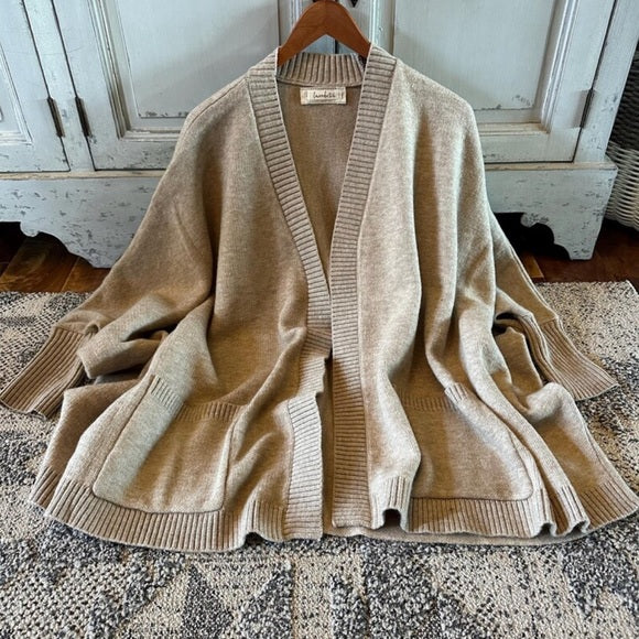Hanging Front View Handmade Grey Pocketed Cotton Cardigan Sweater by Lavender Tribe Design. Our Darling Knit Cardigan features an open front, dolman sleeve, pocketed front, soft cotton, and a oversized fit.
+ Soft Grey Thick Knit
+ Dolman Sleeve