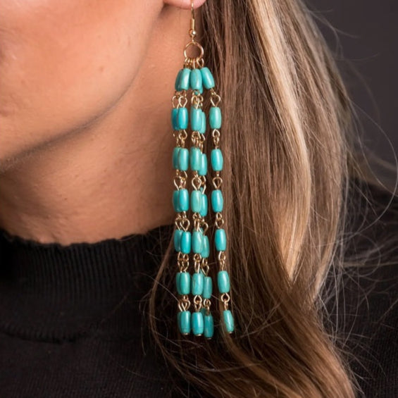 Model wearing Turquoise Beaded Long Tassel Earring